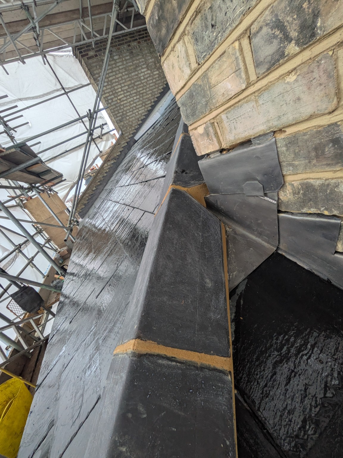 Lead chimney flashing and ridge detail